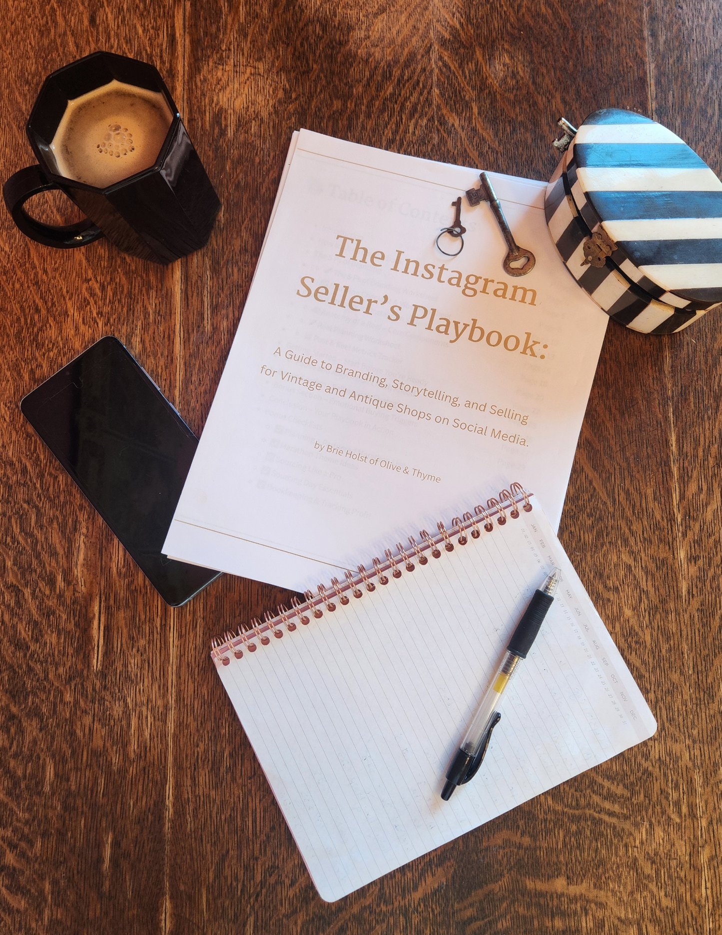 Book titled 'The Instagram Seller's Playbook' on a wooden surface with a pen and coffee mug.