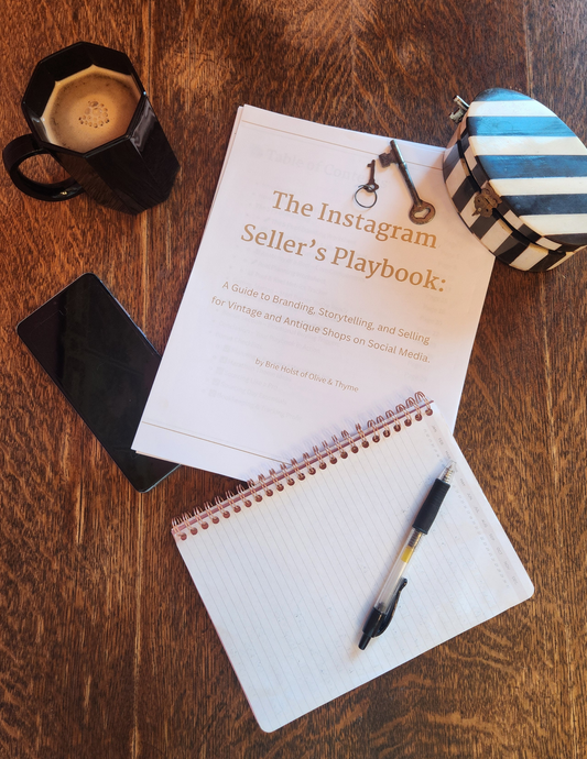 Book titled 'The Instagram Seller's Playbook' on a wooden surface with a pen and coffee mug.